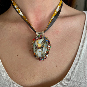 Necklace with glass pendent including the image of a Zebra