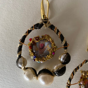 Earrings with pearls and images of sacred heart