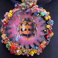 Necklace with pendent with  picture of ladybug