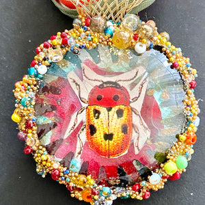 Necklace with pendent with beetle