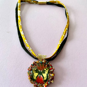 Necklace with pendent of  yellow butterfly